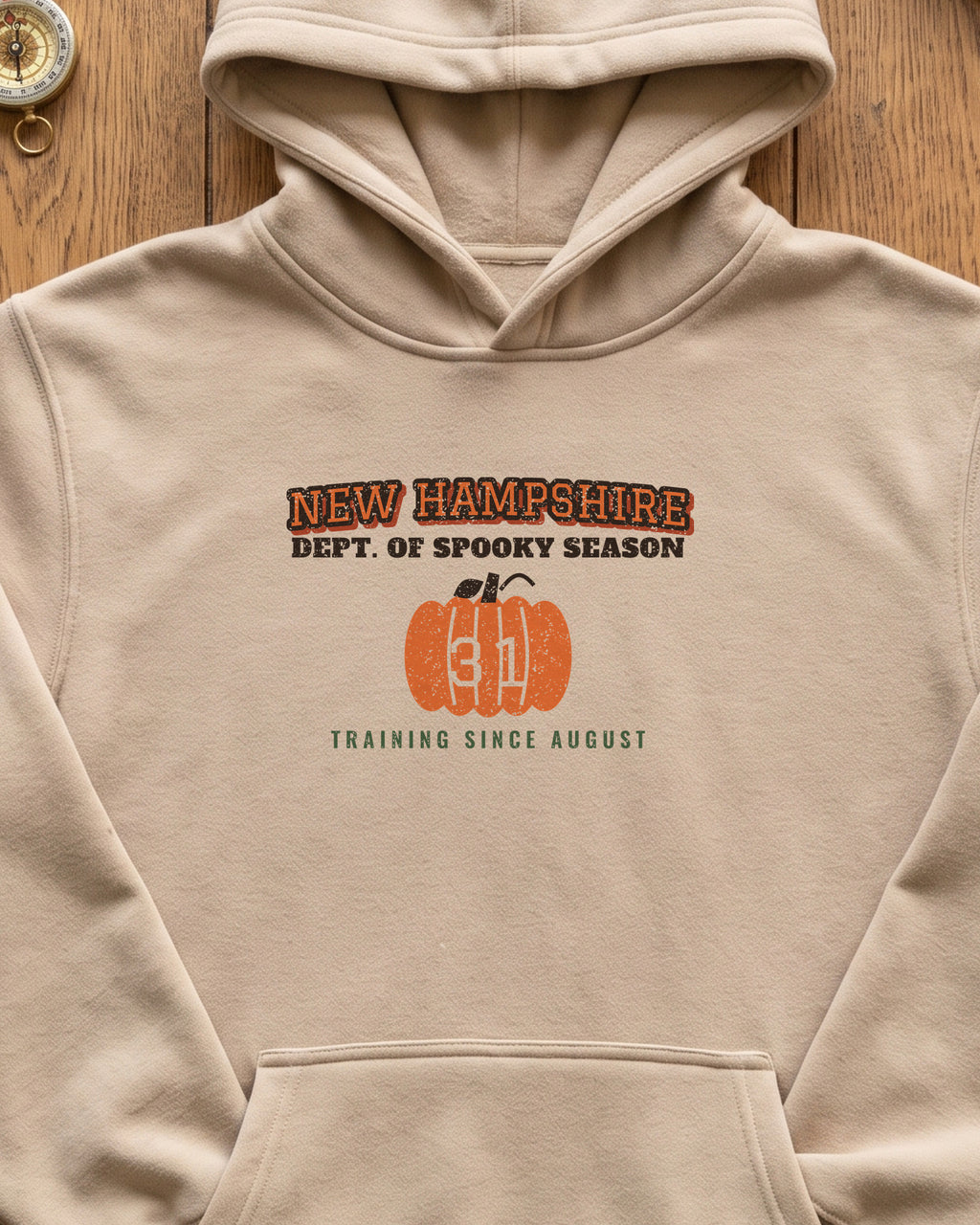 New Hampshire Dept. of Spooky Season Varsity Hoodie (close-up)