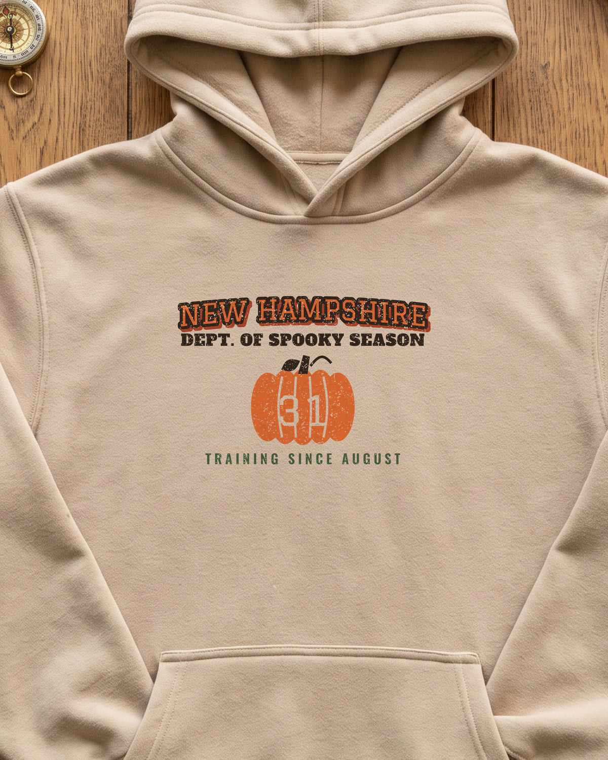 New Hampshire Dept. of Spooky Season Varsity Hoodie (close-up)
