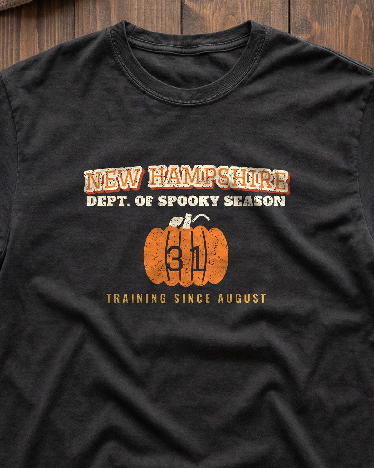 New Hampshire Dept. of Spooky Season Varsity T-Shirt (close-up)