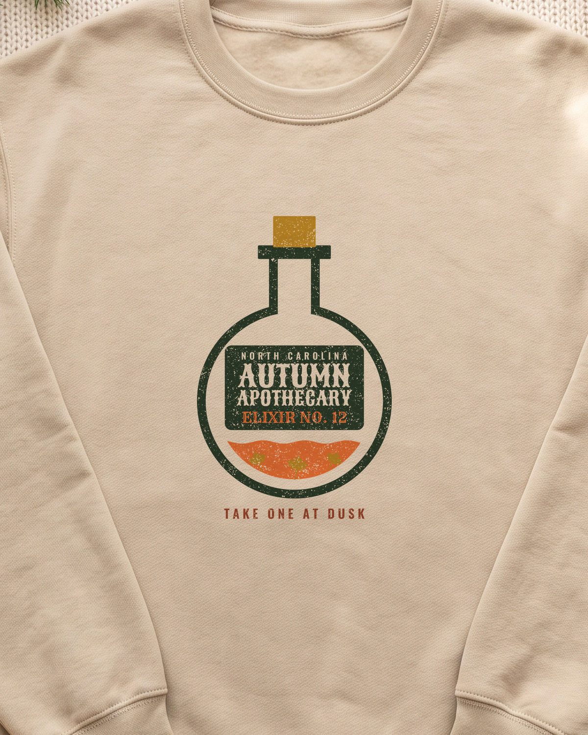 North Carolina Autumn Apothecary Flask Crewneck Sweatshirt (close-up)