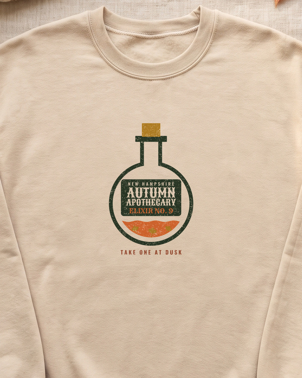 New Hampshire Autumn Apothecary Flask Crewneck Sweatshirt (close-up)
