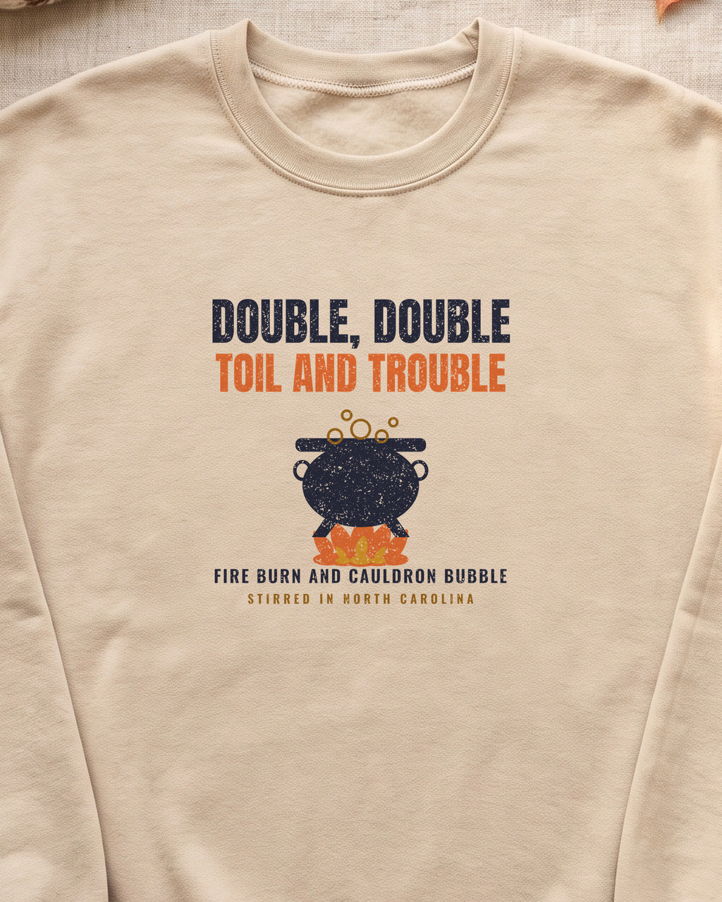 Double Double Toil and Trouble North Carolina Crewneck Sweatshirt (close-up)