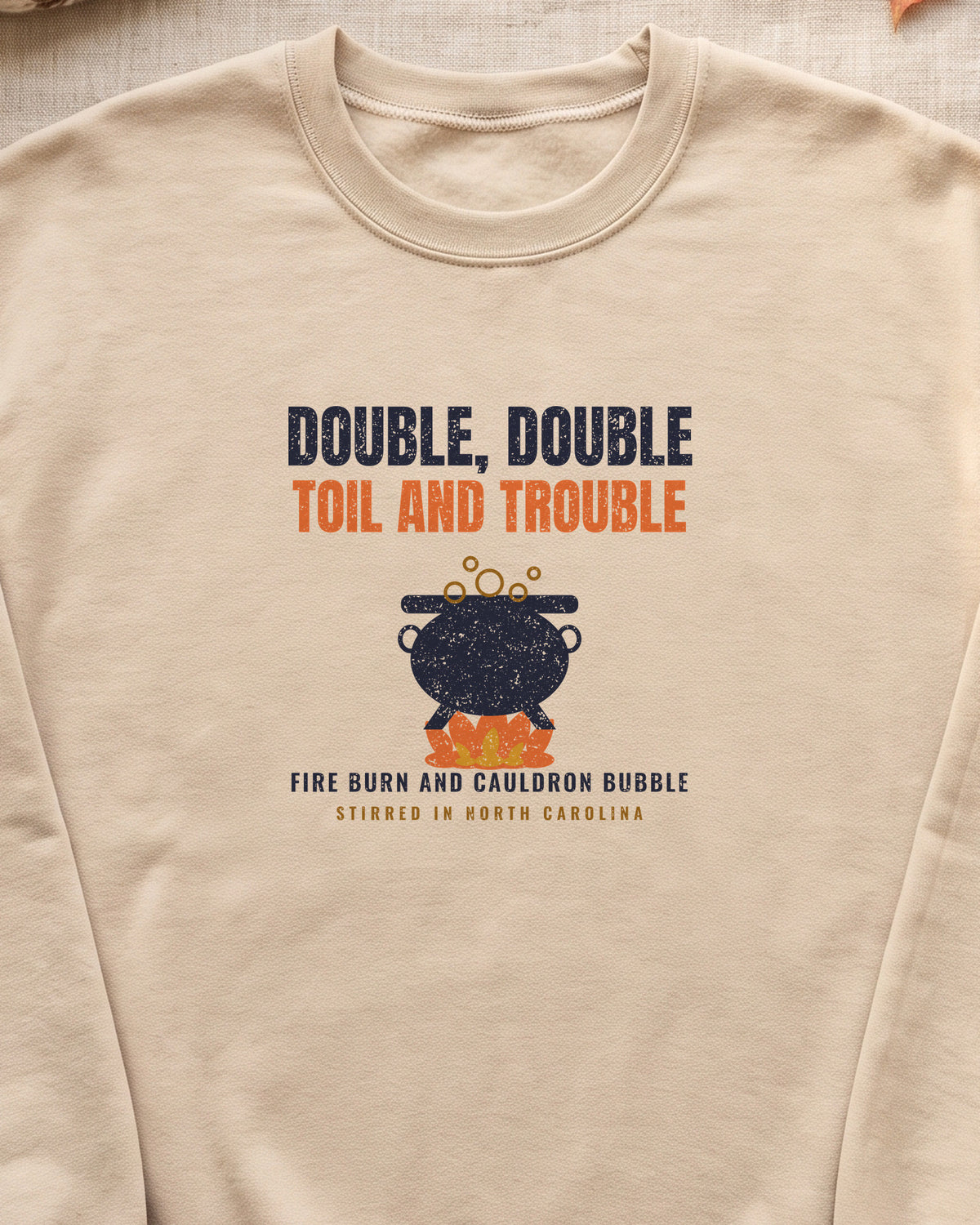 Double Double Toil and Trouble North Carolina Crewneck Sweatshirt (close-up)