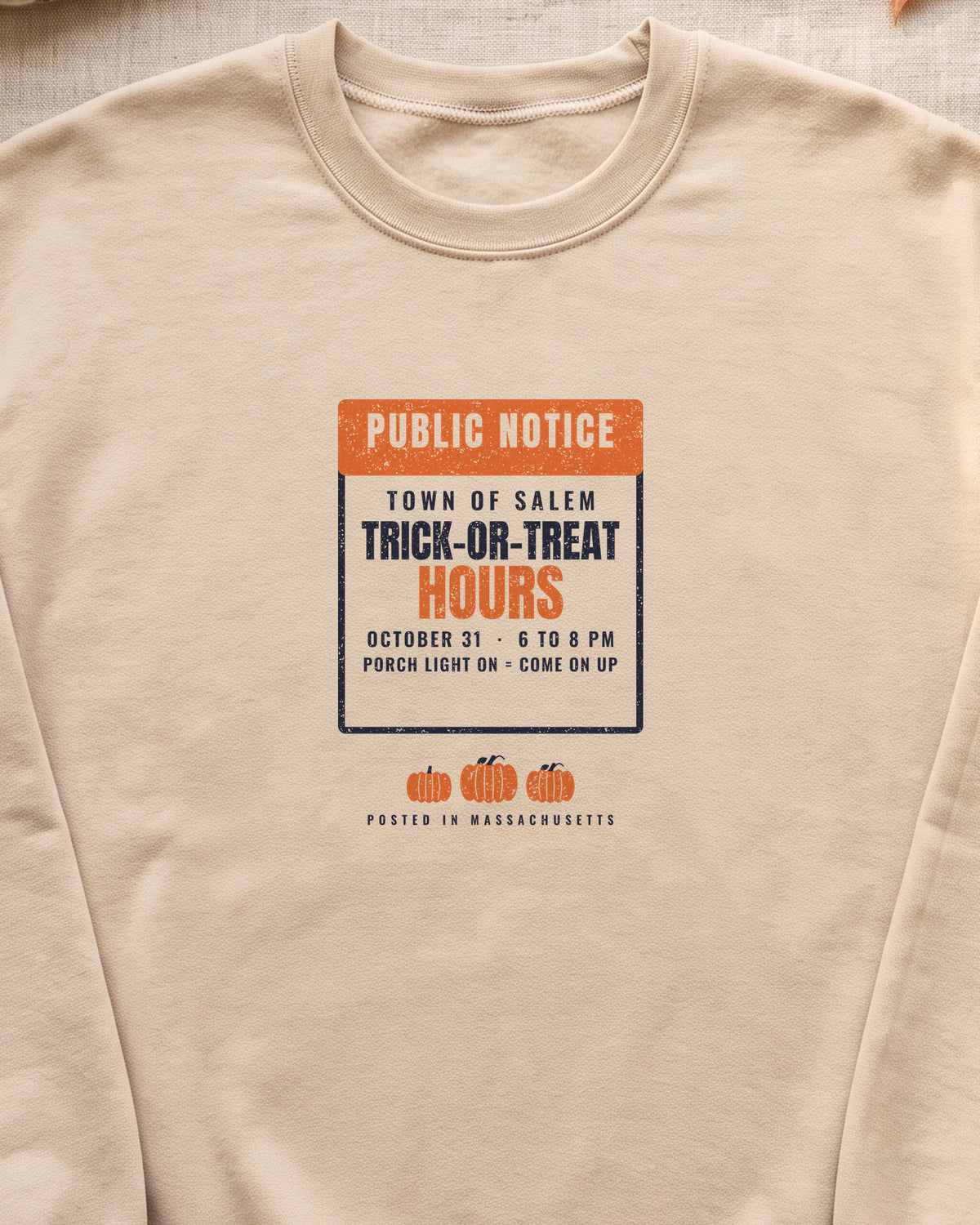 Salem Massachusetts Trick-or-Treat Hours Notice Crewneck Sweatshirt (close-up)