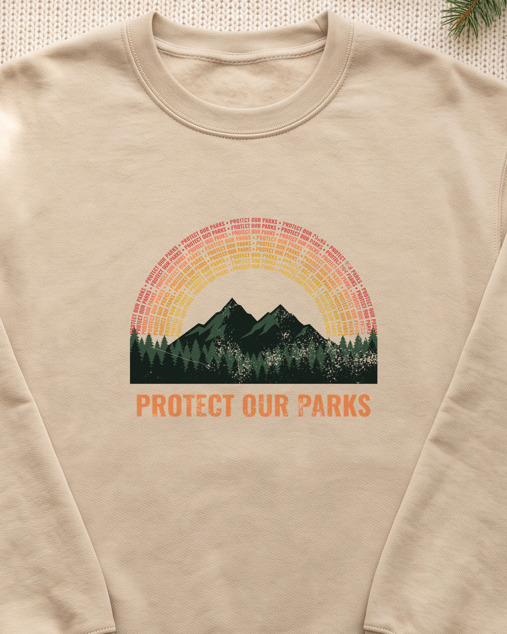 Protect Our Parks Retro Sunset Mountains Crewneck Sweatshirt (close-up)