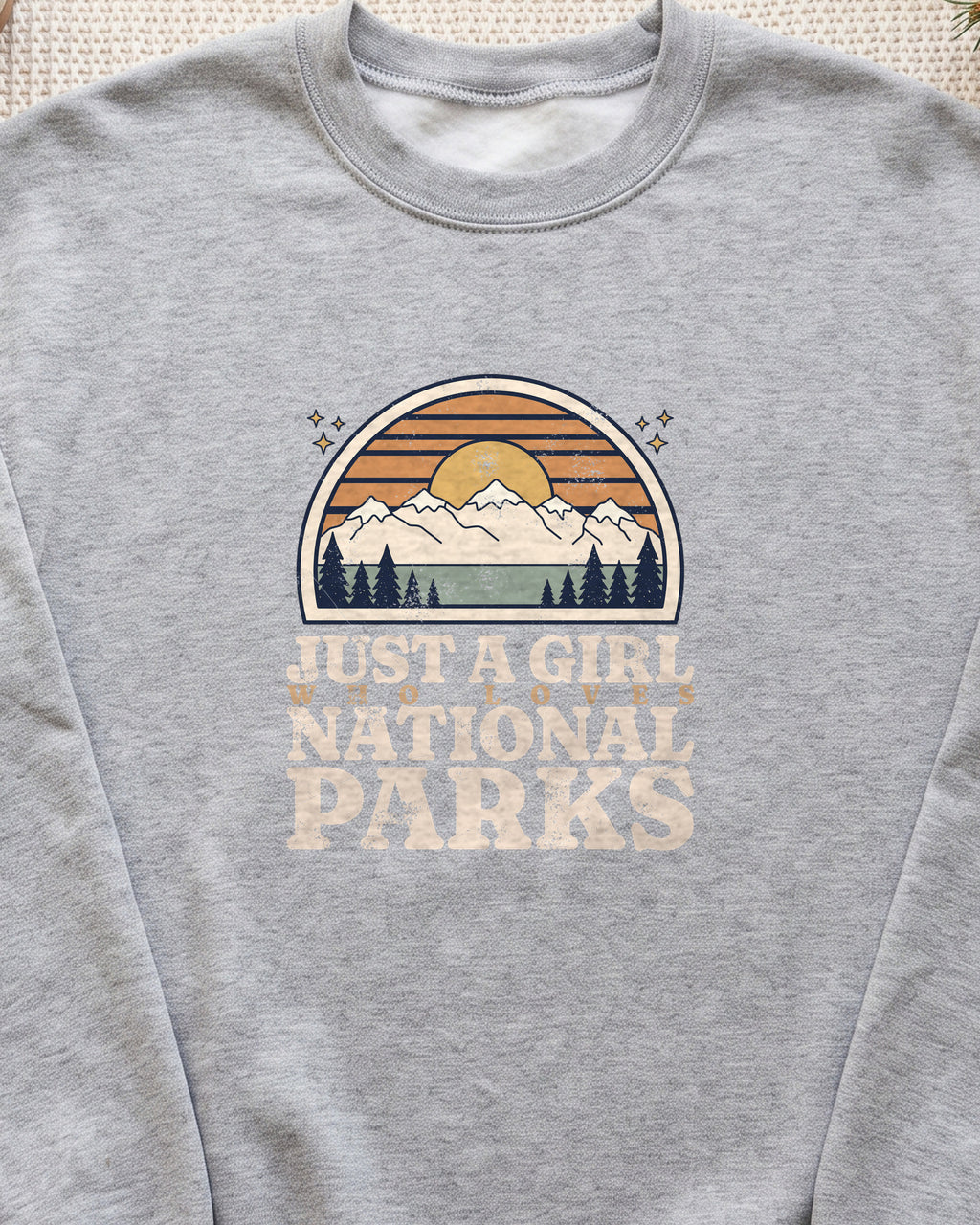 Just a Girl Who Loves National Parks Retro Sunset Crewneck Sweatshirt (close-up)