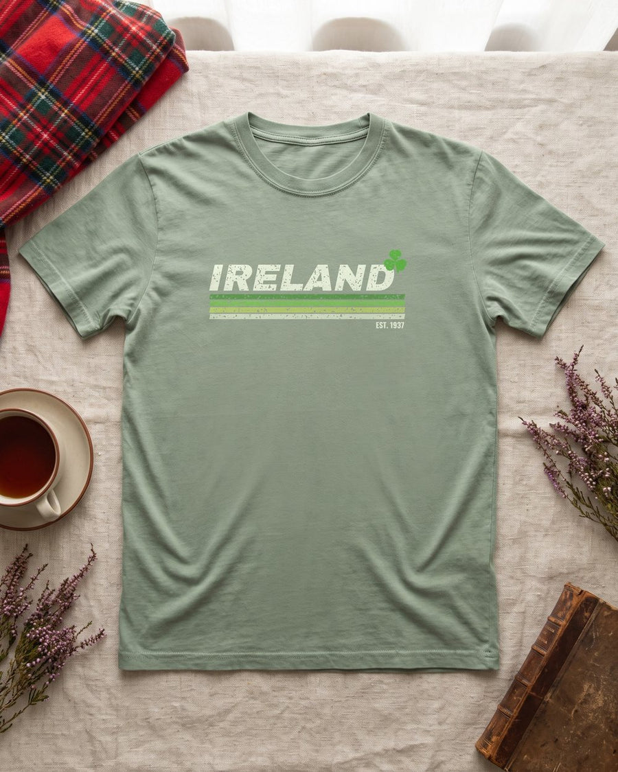 Sage green T-shirt with a retro Ireland stripe design, laid flat